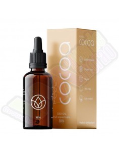 Botella marrón de aceite de CBD "Feel Cocoa" con concentración del 15%, junto a una caja dorada con detalles del producto.